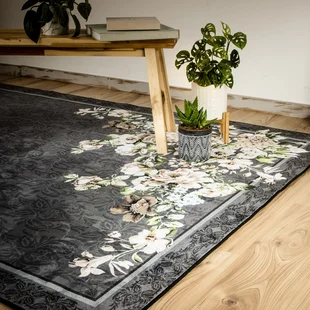 Illustration - Ihr Experte für schönes Wohnen - Ein graumelierter Teppich mit einem floralen Muster